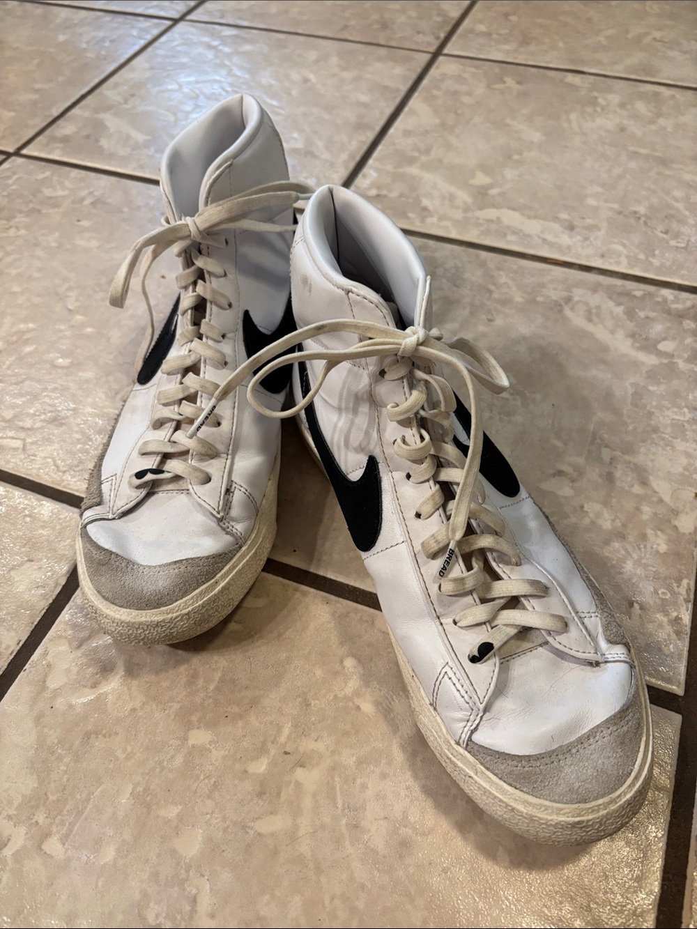Nike White High-Top Sneakers with Black Swoosh